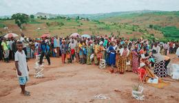 Boy Nelson looking at the line for supplies in Ugandan refugee settlement_Uganda_War Child_190917