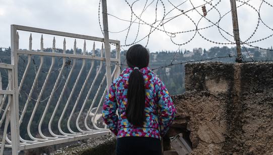 Girl from OPT in front of barbed wire_War Child in OPT_191211