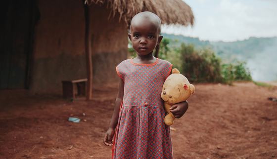 War Child Ugandan girl with teddy bear in hands_War Child Uganda_190914.jpg